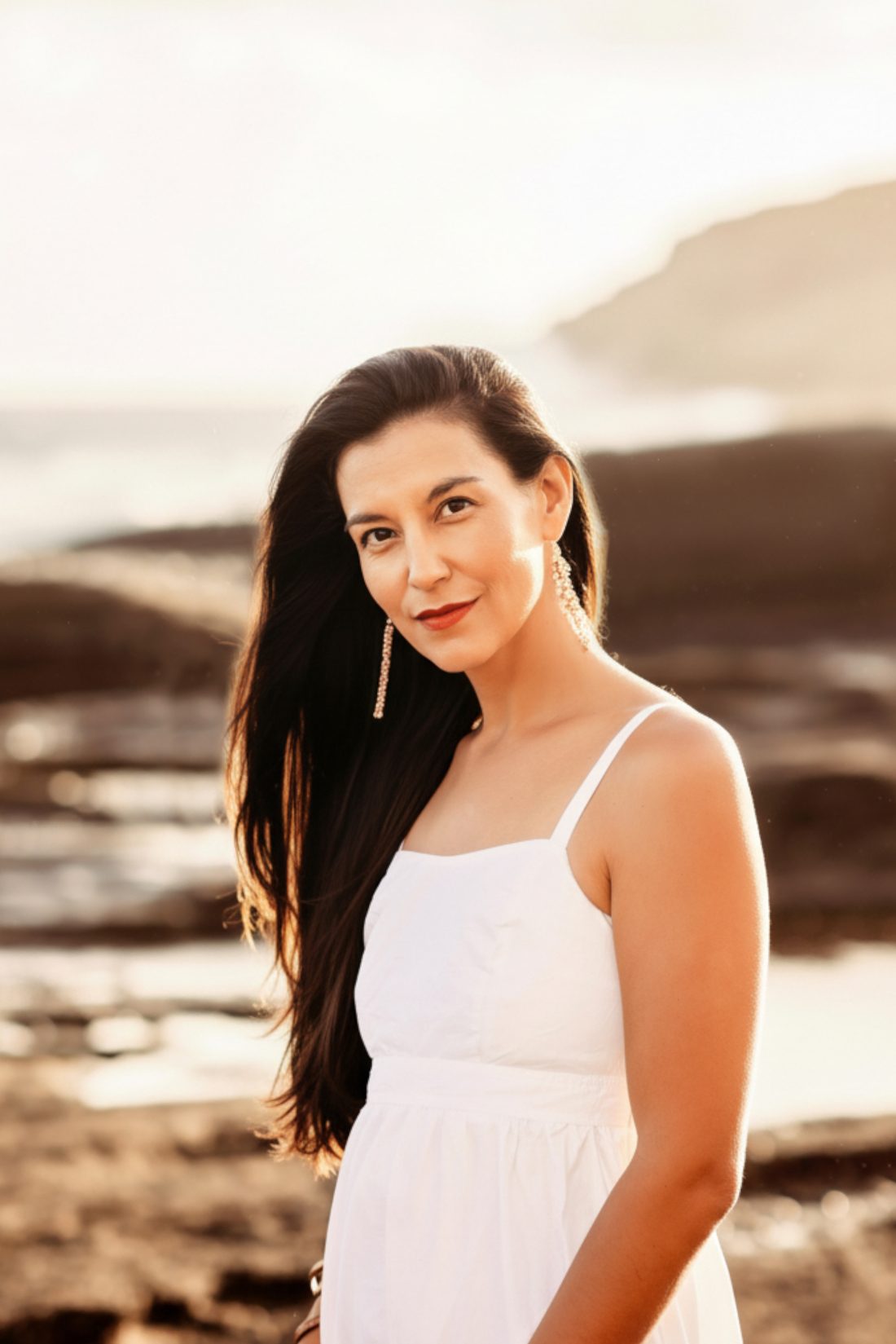 Katie Nickens at sunset on the Oʻahu shoreline